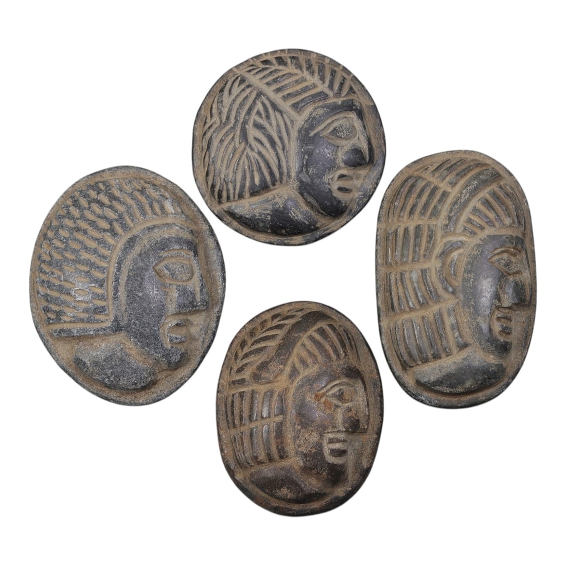 Lot of 4 Ancient Coptic Egyptian Stone Face Beads / Amulets, Circa Roman to Coptic Era, 26AE: Comprising four finely carved stone face amulets ranging from 3 cm to 4 cm, these pieces are characteristic decorative and protective jewelry from the Coptic Egyptian period. Each bead is rendered in 