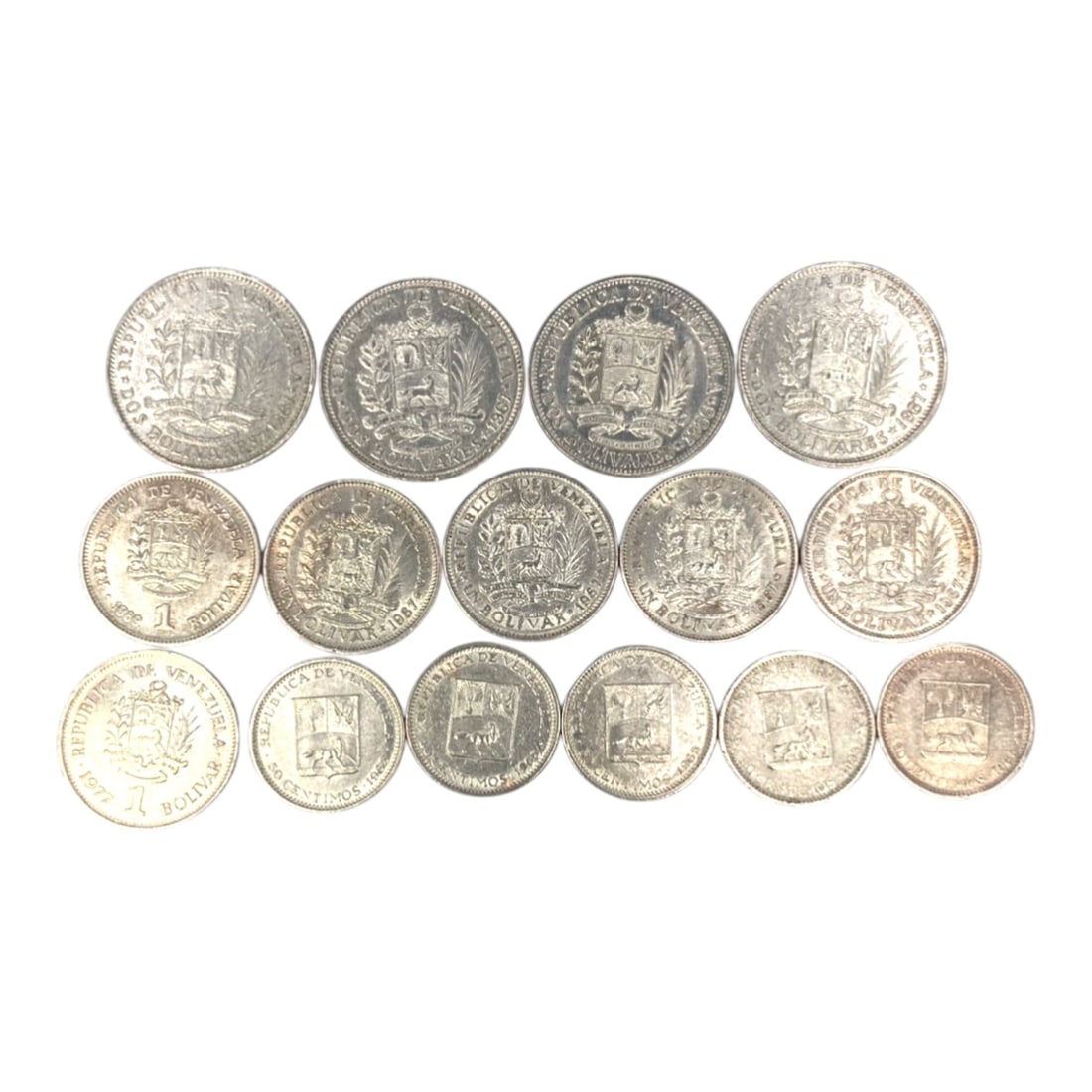 VENEZUELA: Bolivarian Legacy - 15-Piece Coins Set, 1965-1990, 20-27mm, 53ZJ: This 15-Piece Coins Set of Venezuelan coins, minted between 1965 and 1990, encapsulates the nation's enduring Bolivarian legacy and evolving economic identity. Ranging from 20 to 27mm in diameter, the