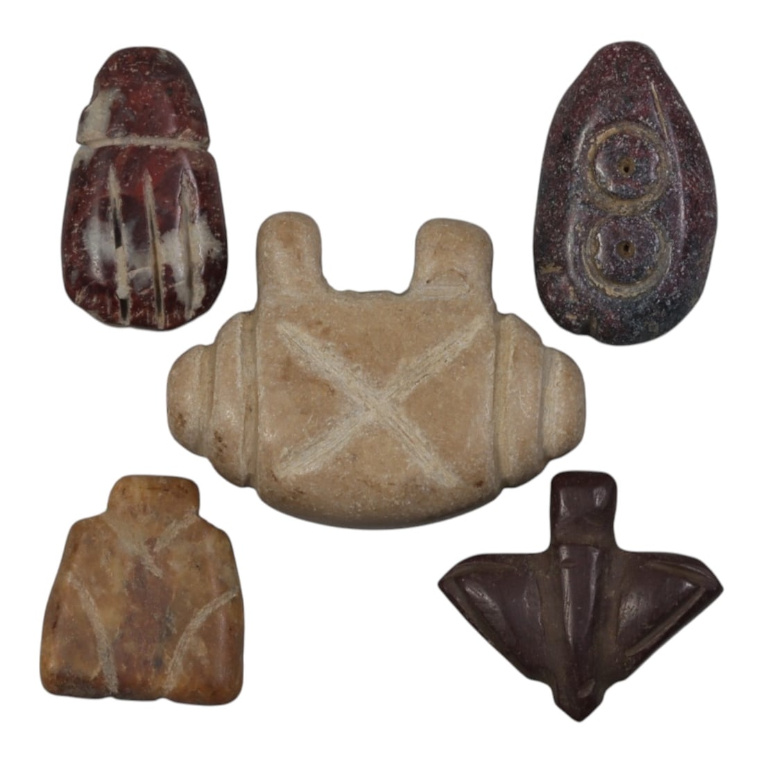 Lot of 5 Ancient Coptic Egyptian Stone Amulets, Circa Roman to Coptic Era, 88WP: Carved from various stones, including reddish-brown with white inclusions, light beige, tan, and dark brown varieties, the group consists of five amulets of distinct forms. The set includes a scaraboi
