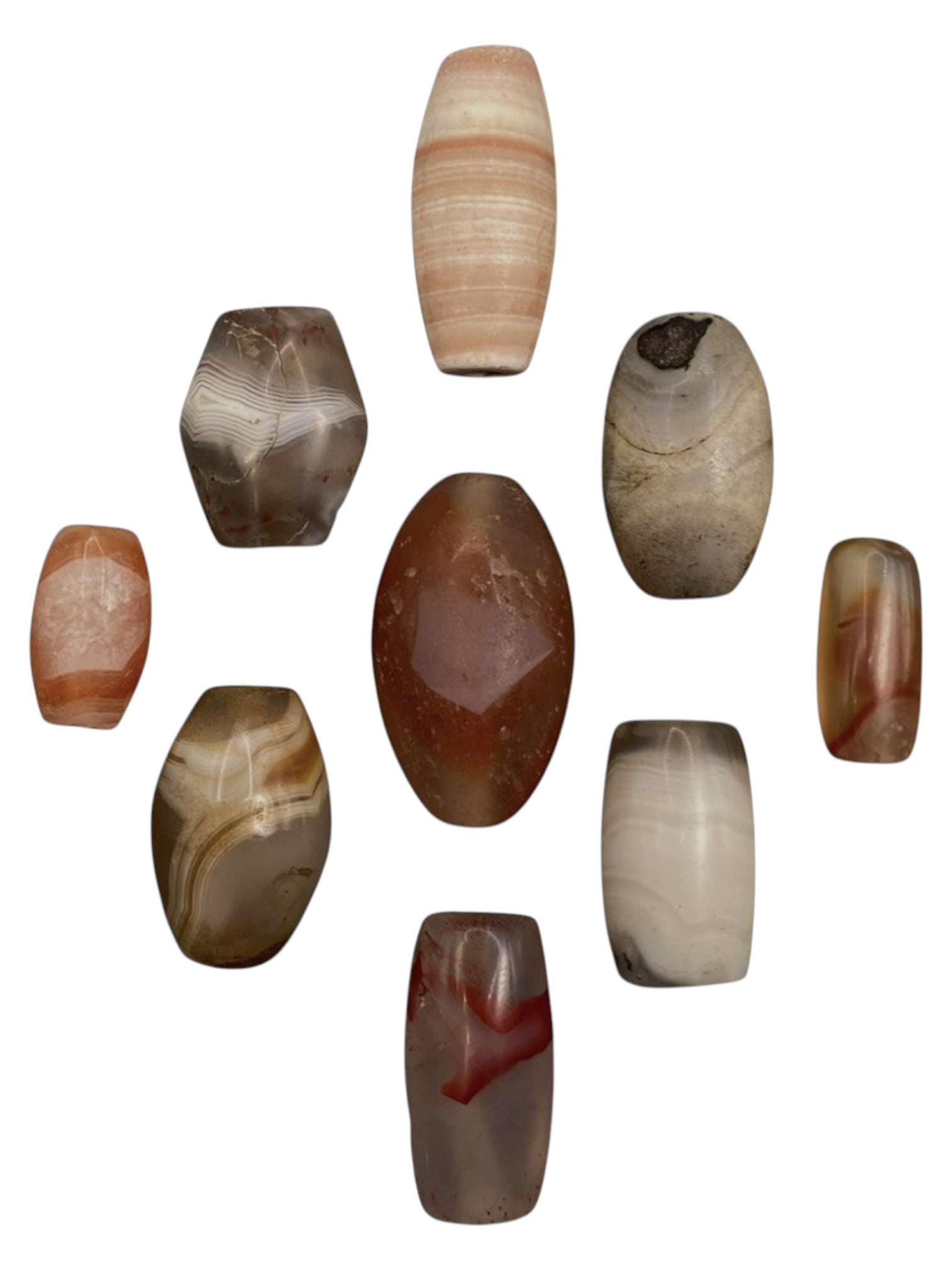 Lot of 9 Himalayan Banded Agate Beads, Ancient to Antique Period, 37WT: A group of nine beads crafted from banded agate, showcasing natural hues including translucent grey, milky white, peach, and rich reddish-brown tones, with characteristic concentric, wavy, and linear 