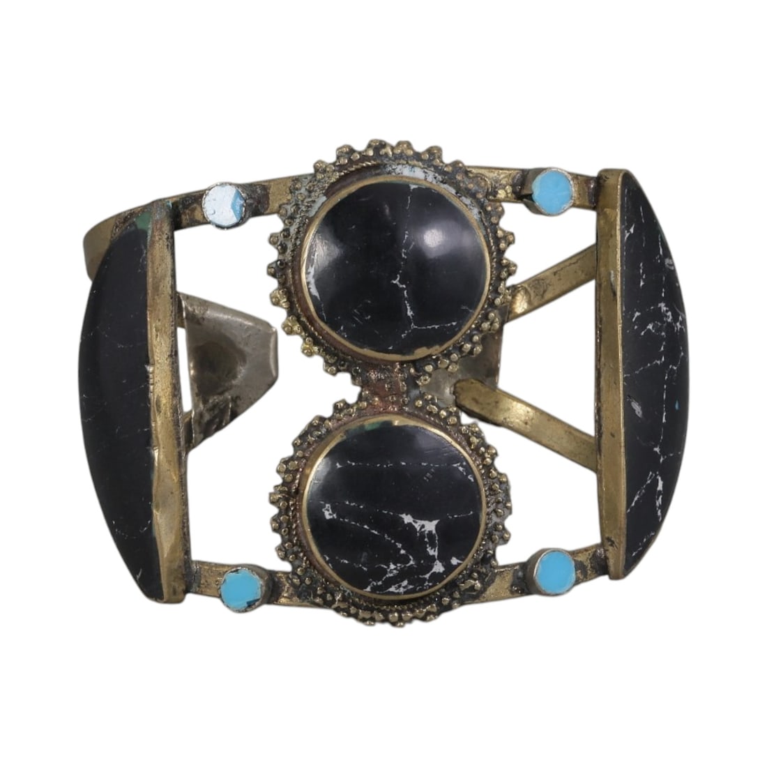 A Vintage Himalayan Stone Inlay Cuff Bracelet, 58AH: A handcrafted vintage cuff bracelet, measuring approximately 6 cm in width, showcasing traditional Himalayan jewelry design. The piece features a mixed metal base (likely brass or bronze) with ornate 