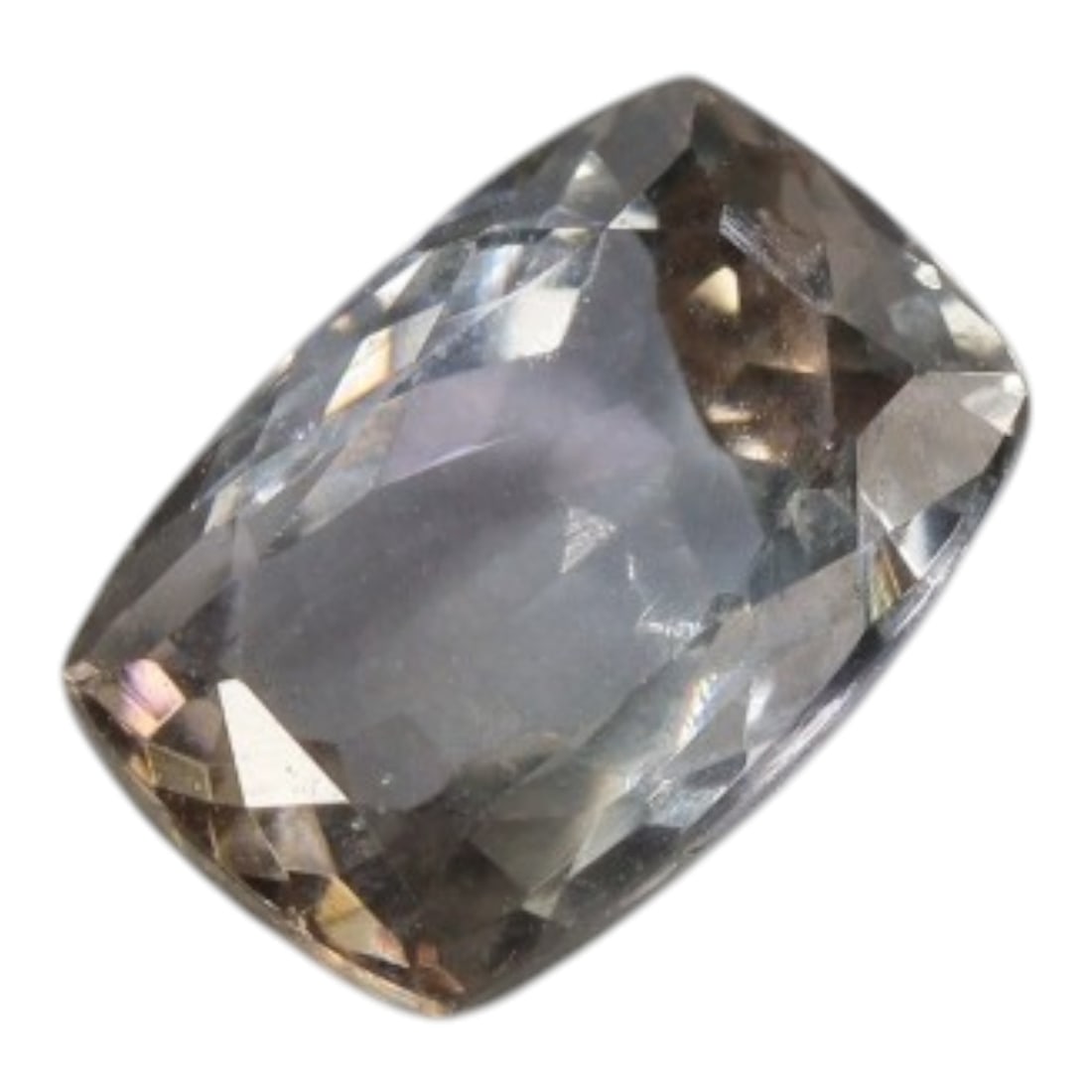 2.06 Carats Grayish-Blue Tanzanite Cushion - Natural Tanzanian Stone, 57XK: This single cushion-cut tanzanite exhibits a soft, misty grayish-blue hue, accented by subtle warm undertones that add depth to its color profile. The faceted cut creates gentle light play across the 