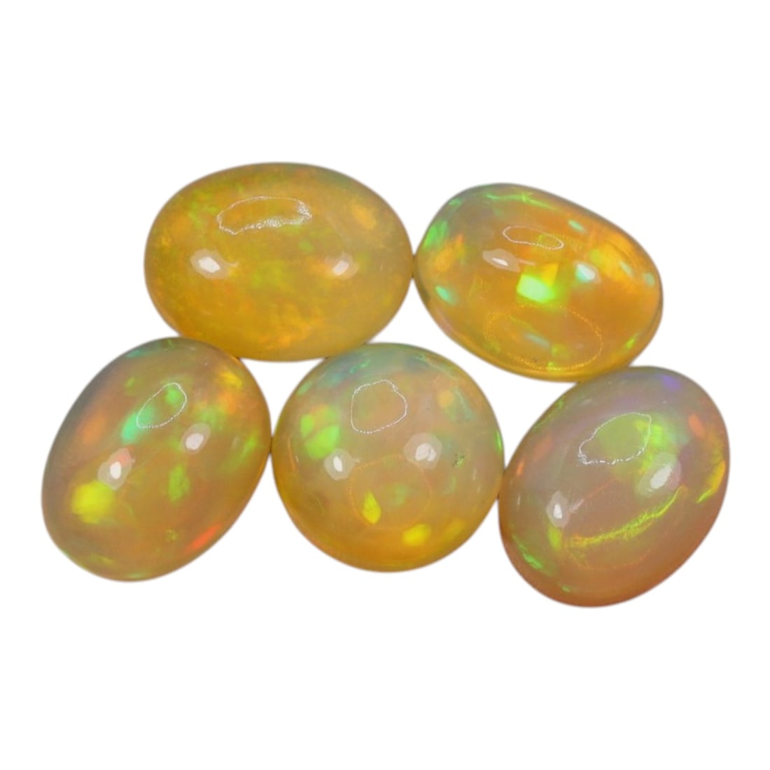 6.27 Carats Welo Opal Oval Cabochon Parcel - Natural Ethiopian Stones, 52WD: This luminous parcel of five Welo opals showcases a warm, honey-toned base with vivid, shifting flashes of lime green, golden yellow, and subtle orange across each stone. The total carat weight of the