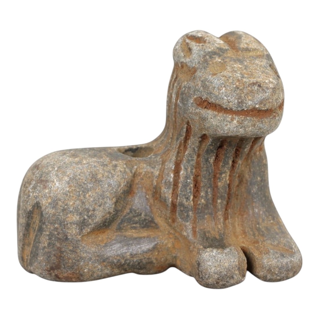 Ancient Stone Caprine Amulet - Near Eastern Animal Figurine, 41AM: This amulet is carved from speckled grey stone, depicting a stylized caprine (goat or sheep) in a recumbent, crouched posture. The piece features incised linear detailing defining the facial features,
