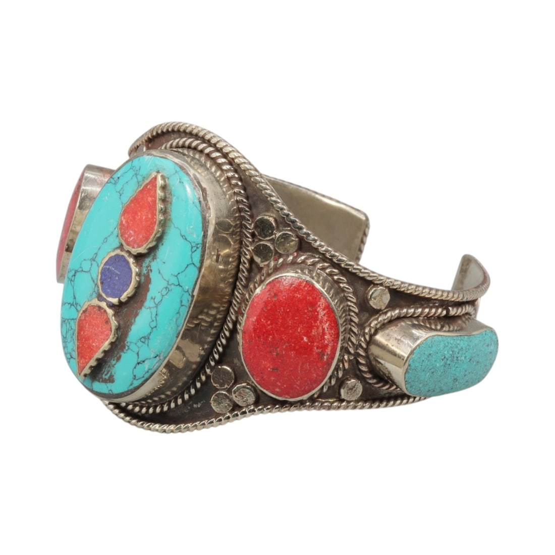A Vintage Himalayan Silver-Plated Multi-Stone Inlay Cuff Bracelet, 28AH: A handcrafted vintage cuff bracelet, measuring approximately 6 cm in width, showcasing traditional Himalayan jewelry design. The piece features a silver-plated metal base, with a large oval turquoise 