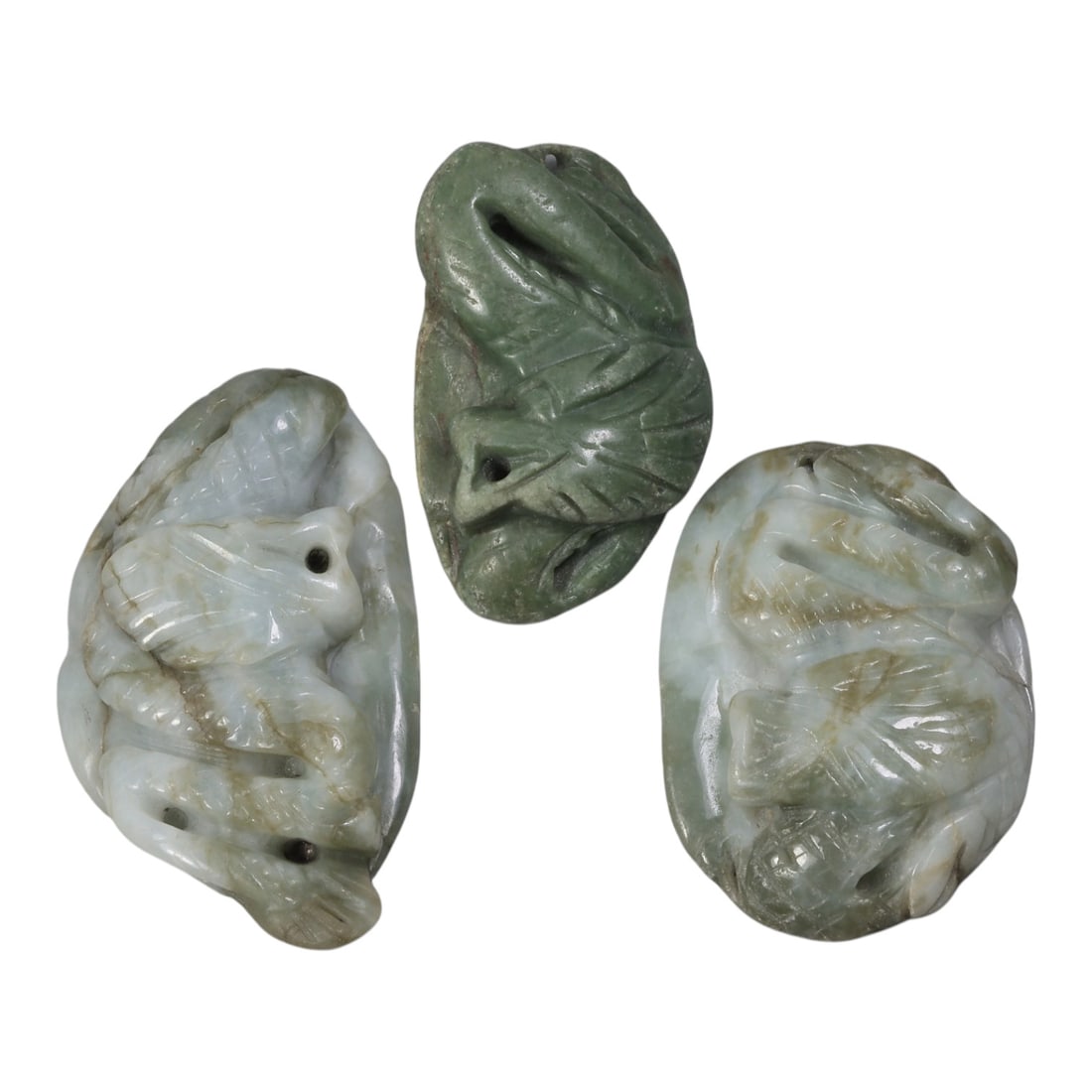 Lot of 3 Antique Oriental Chinese Jadeite Jade Carved Pendants, 46AG: The lot comprises three free-form jadeite pendants. The left pendant is carved from light greenish-white jadeite with natural brown inclusions, depicting a mythical dragon-like creature with defined s