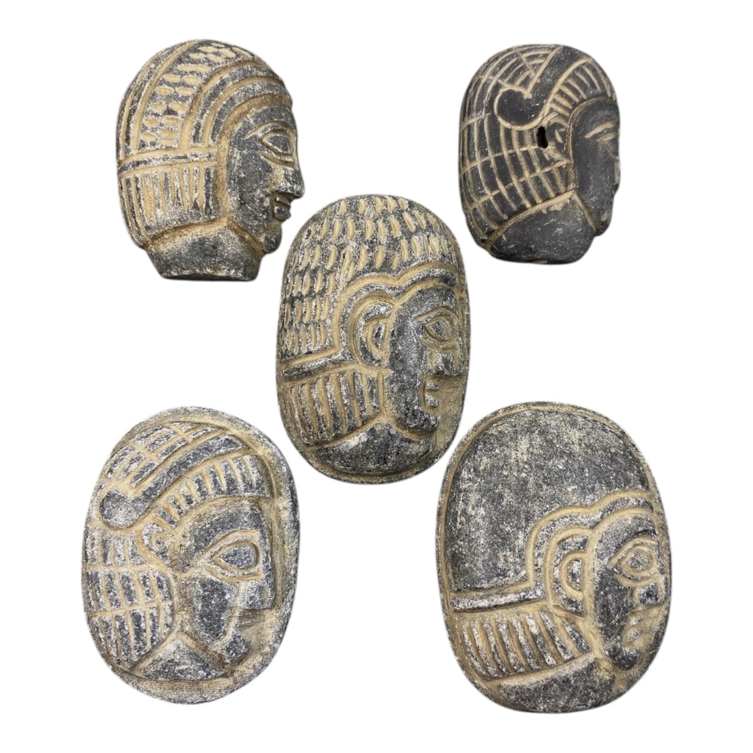 Lot of 5 Ancient Coptic Egyptian Stone Face Beads / Amulets, Circa Roman to Coptic Era, 24AE: Comprising five finely carved dark stone face amulets ranging from 3.5 cm to 4.5 cm, these pieces are characteristic decorative and protective jewelry from the Coptic Egyptian period. Each bead is ren