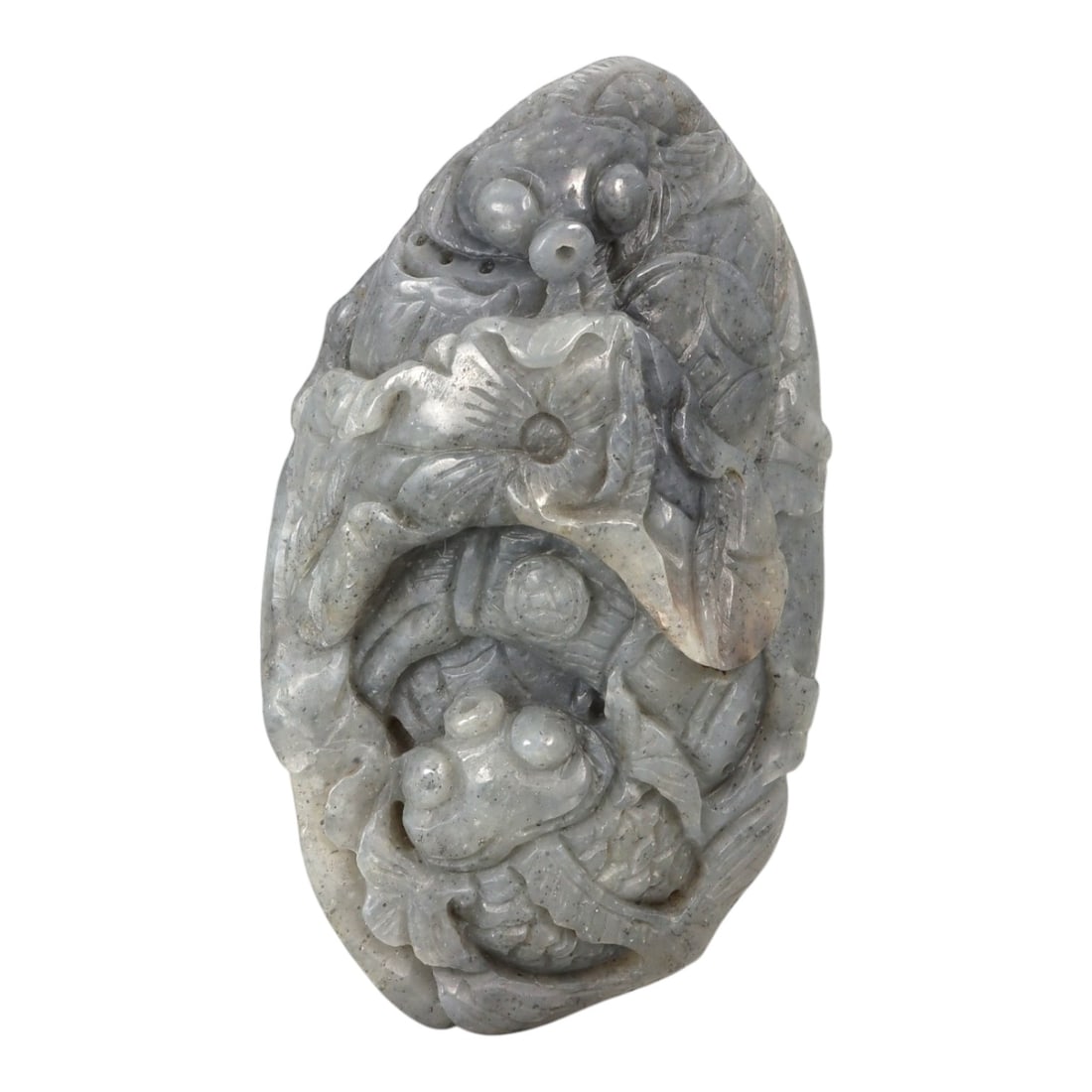 A Chinese Nephrite Jade Fish Carving, 20th Century, 19YB: Carved from pale grey nephrite jade with darker speckled inclusions and subtle tonal variation, the object is worked as a vertical composition featuring multiple fish arranged in a stacked and interlo