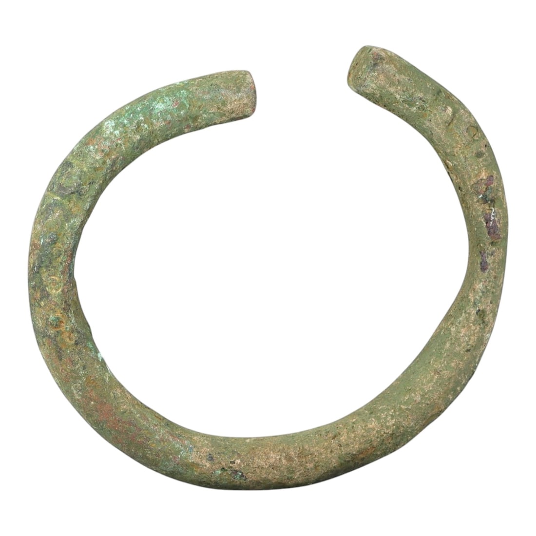 Ancient Bronze Bracelet - Roman Open Cuff Bangle, 38BN: An open-form bracelet crafted from thick cast bronze, with a robust rounded cross-section and squared terminals. The utilitarian form is characteristic of Roman provincial jewelry, designed for durabi