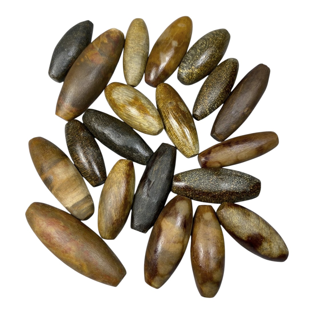 Lot of 20 Antique Himalayan Tibetan Fossilized Wood Ritual Beads, 62AG: A collection of 20 antique Himalayan Tibetan ritual beads, carved from natural fossilized wood with rich, earthy hues ranging from warm amber and golden brown to deep black and speckled tones. Each be