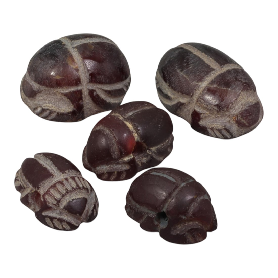 Lot of 5 Ancient Coptic Egyptian Carnelian Scarabs, Circa Roman to Coptic Era, 90WT: Carved from carnelian, the group consists of five distinct scarab amulets. Each piece features the characteristic scarab form with incised details representing the beetle's back, legs, and body segmen