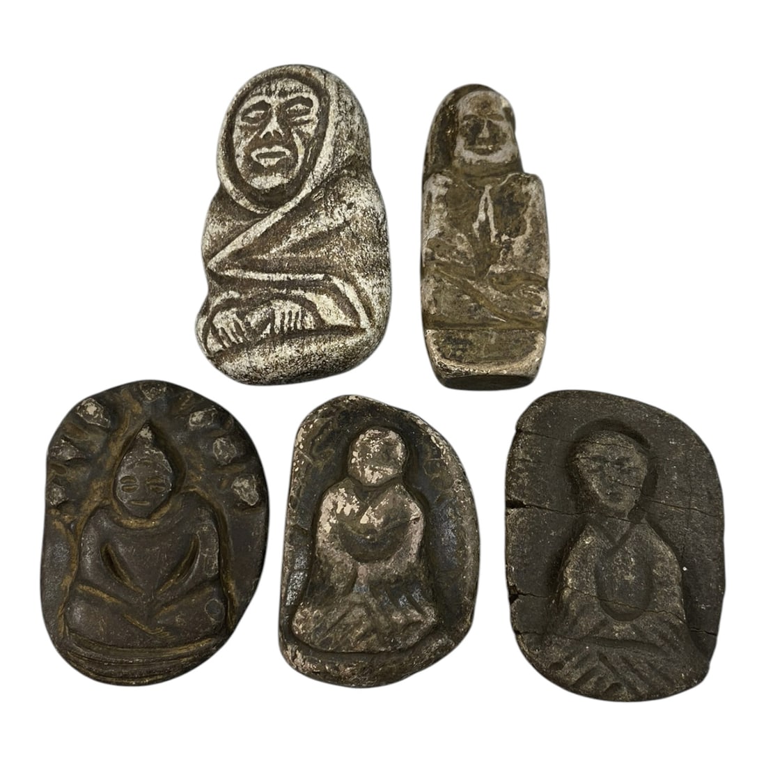 Lot of 5 Antique Japanese Edo Period Stone Buddhist Amulets, 69AG: A collection of five hand-carved stone Buddhist amulets attributed to the Edo period (1603-1868), Japan. Crafted from dark weathered stone with traces of silver or white pigment, the pieces exhibit si