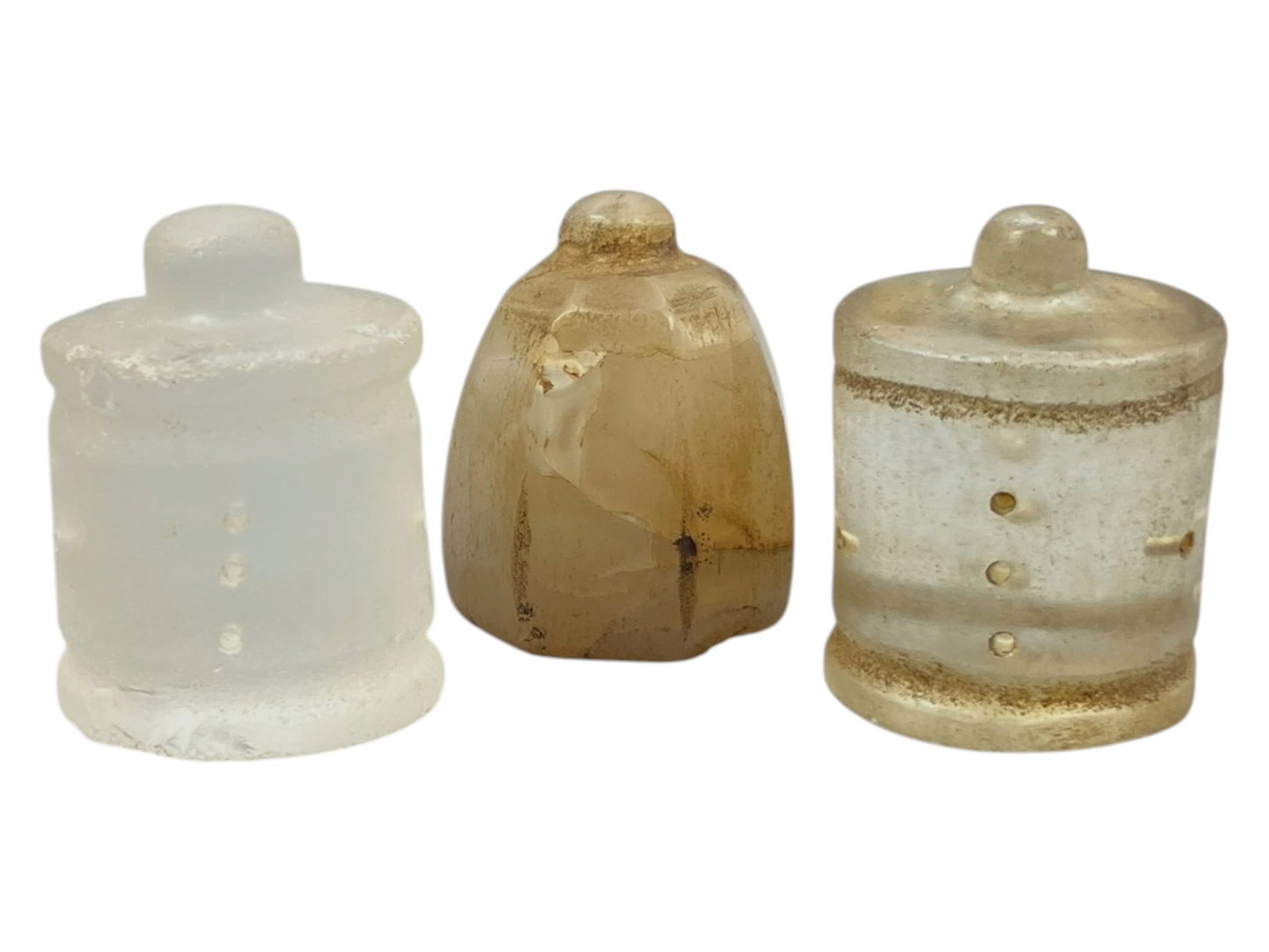 Lot of 3 Ancient Glass Relic Finials, 42WK: The lot comprises three glass relics of varying forms: two cylindrical examples and one bell-shaped form, all topped with small knobs. The translucent glass ranges from clear to pale amber tones, exhi