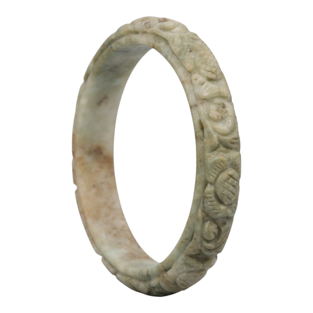 A Chinese Carved Jadeite Jade Bangle Bracelet, 20th Century, 23ZL: A fine jadeite bangle of flattened circular form, masterfully carved in relief with a continuous band of floral blossoms and scrolling foliate motifs. The stone exhibits a pale milky-green base, accen