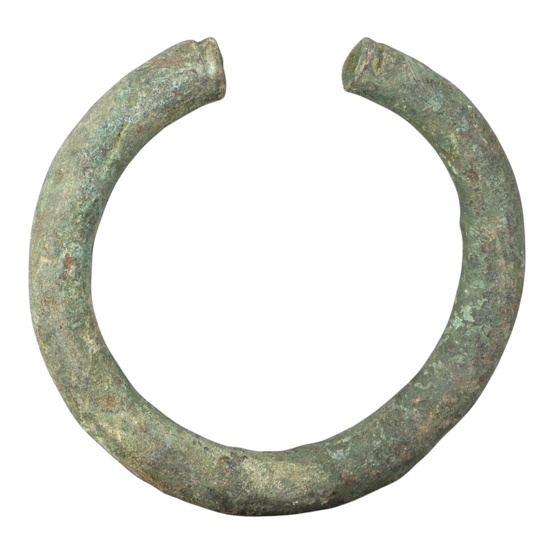 Ancient Bronze Bracelet - Roman Decorated Open Bangle, 43BN: An open-form bracelet crafted from thick cast bronze, with a robust rounded cross-section and squared terminals, each bearing simple incised decoration. The form is characteristic of Roman provincial 