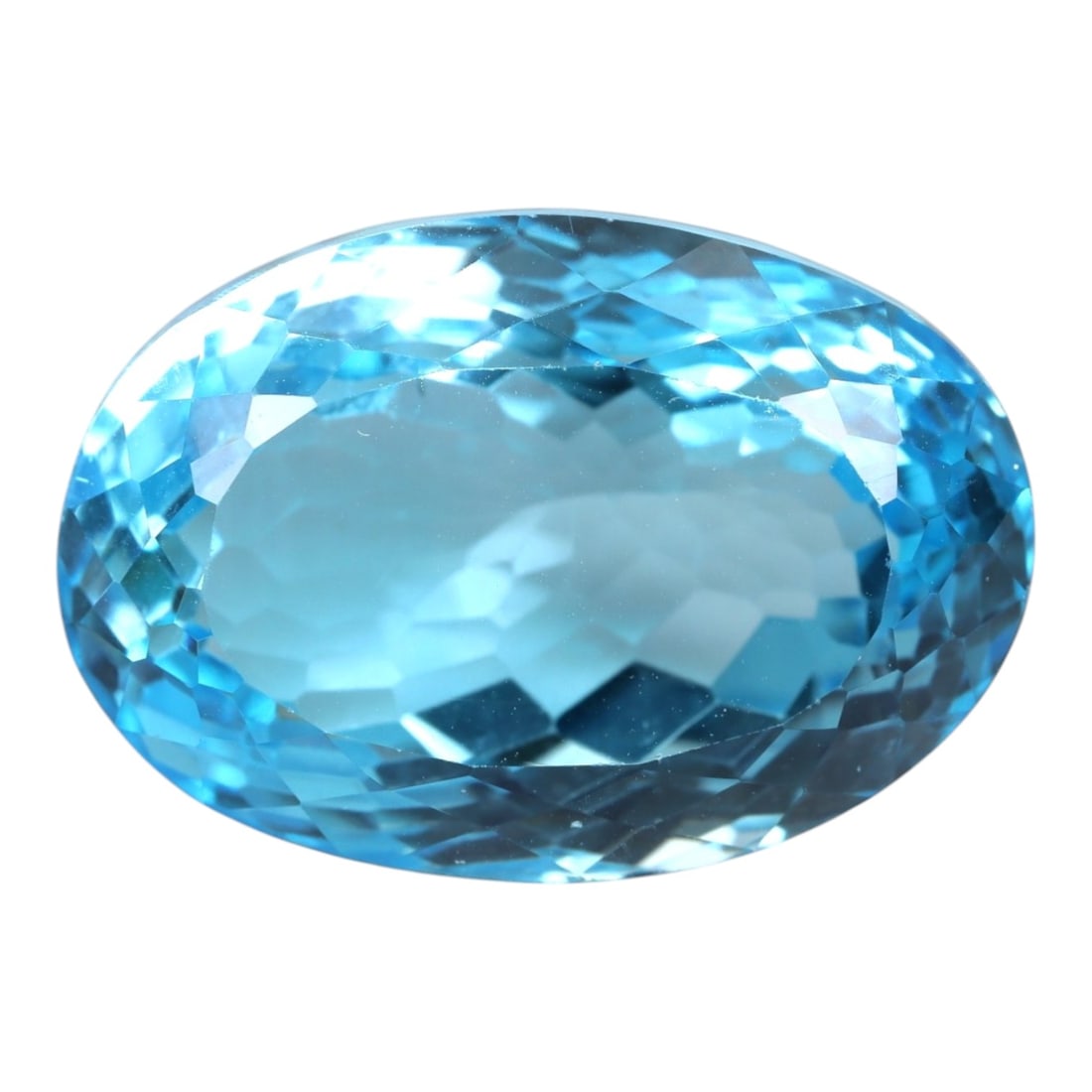39.53 Carats Swiss Blue Topaz Oval - Natural Brazilian Stone, LZ103: This magnificent oval-cut Swiss blue topaz dazzles with a brilliant, saturated sky-blue hue that radiates clarity and light. Its faceted cut is masterfully executed, with precisely angled facets that 