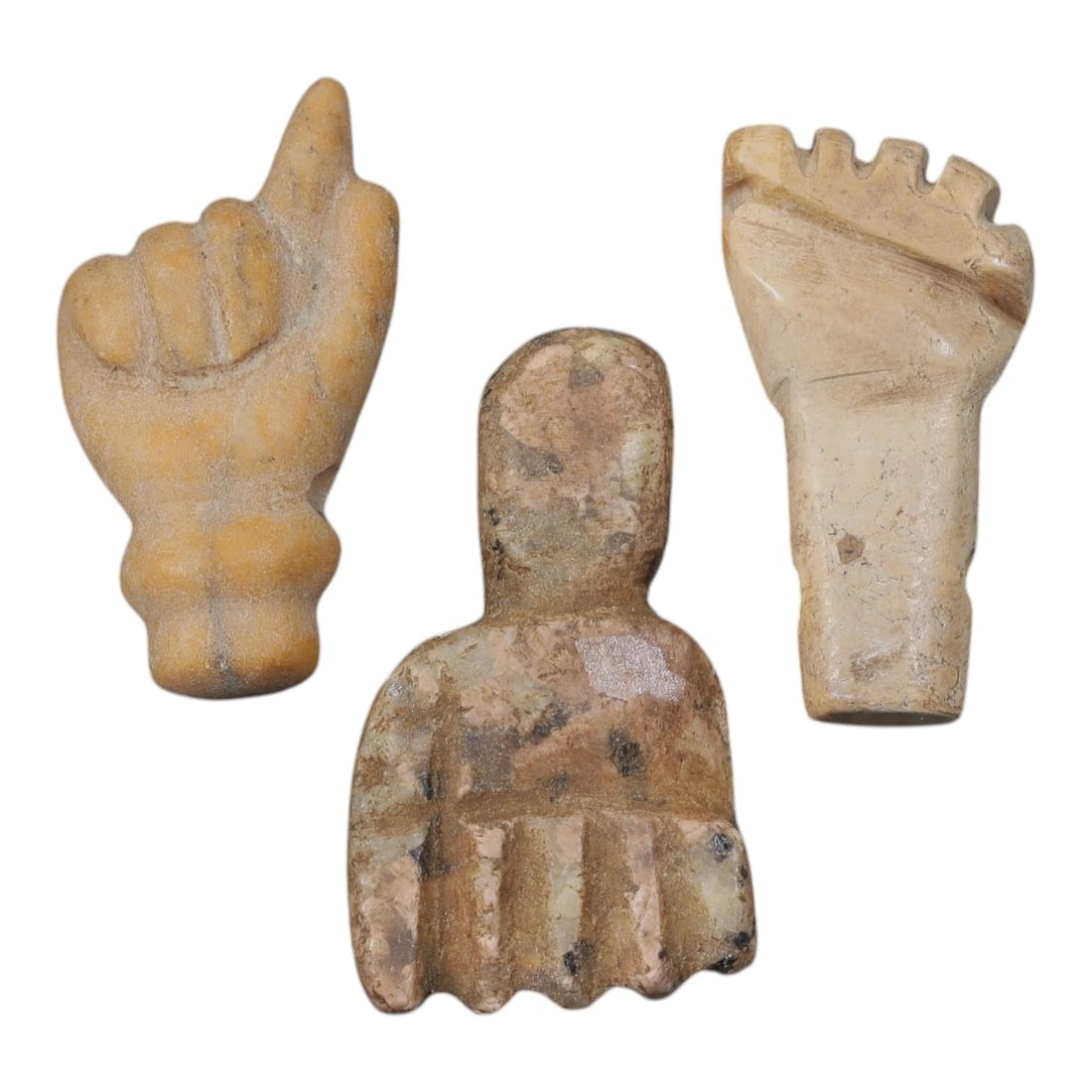 Lot of 3 Ancient Egyptian Stone Fist/Hand Amulets, Circa Late Period to Coptic Era, 12AE: Comprising three carved stone fist and hand amulets ranging from 2 cm to 2.5 cm, these pieces are characteristic protective talismans from ancient Egyptian traditions. Each is rendered in light-toned 