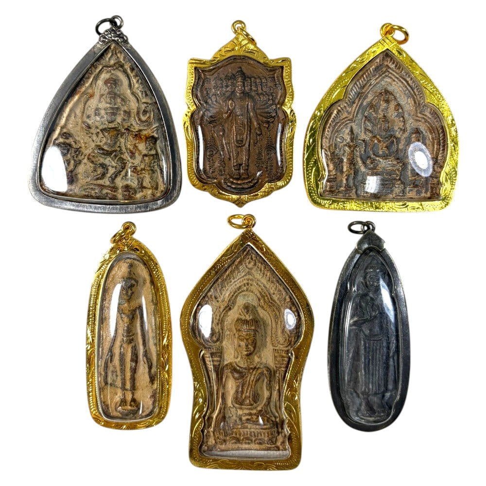 A Lot of 6 Vintage Thai Buddhist Amulets with Metal Cases, 39AA: Comprising six pendants ranging from 6 to 9 cm in height. Each amulet features aged devotional imagery, including seated, standing, and multi-armed Buddha forms, encased in protective metal frames-fou