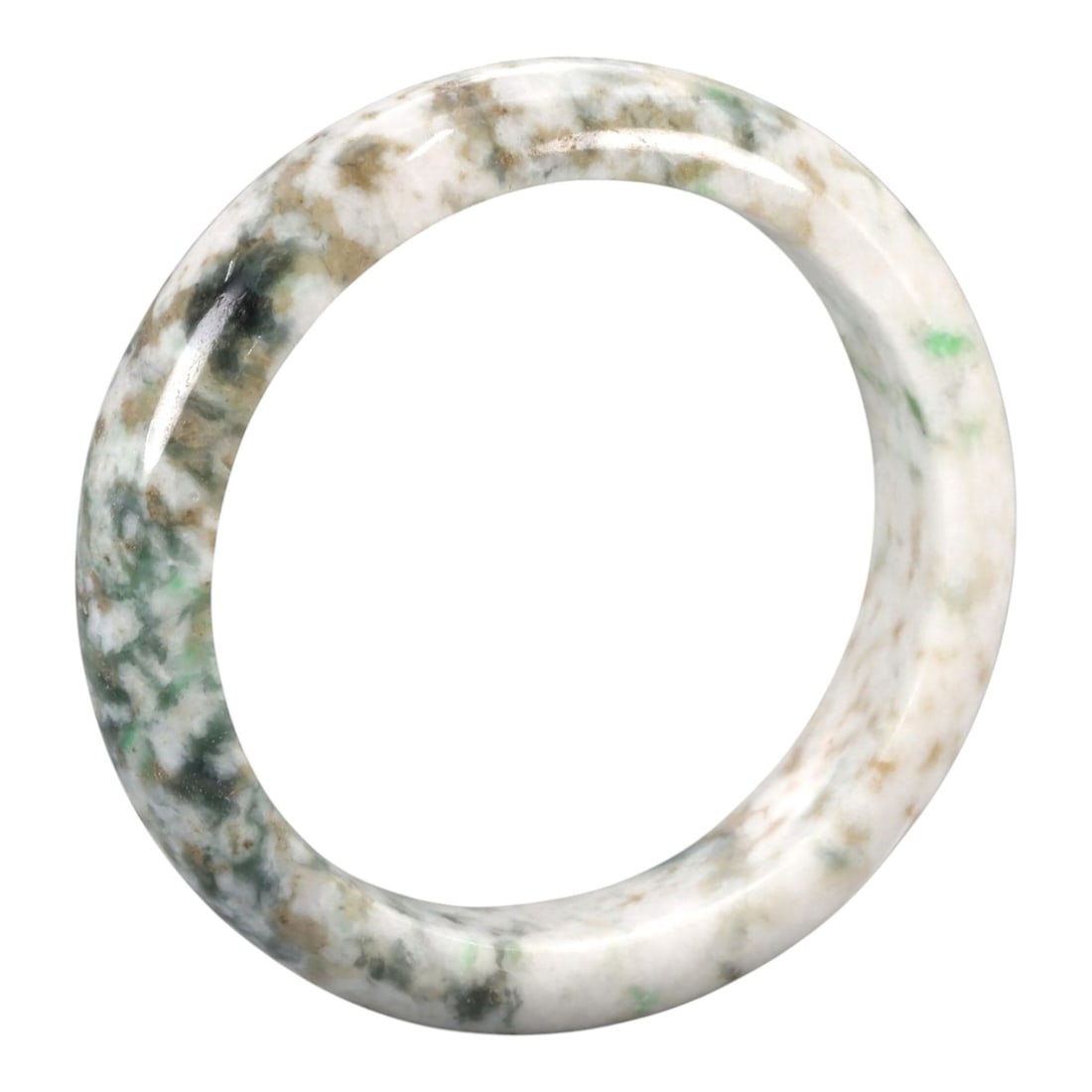 A Chinese Jadeite Jade Bangle Bracelet, 20th Century, 80ZK: Carved from jadeite jade with a pale white base and irregular mottling of green, brown, and dark grey inclusions, the bangle is formed as a continuous circular band with a rounded cross-section. The s