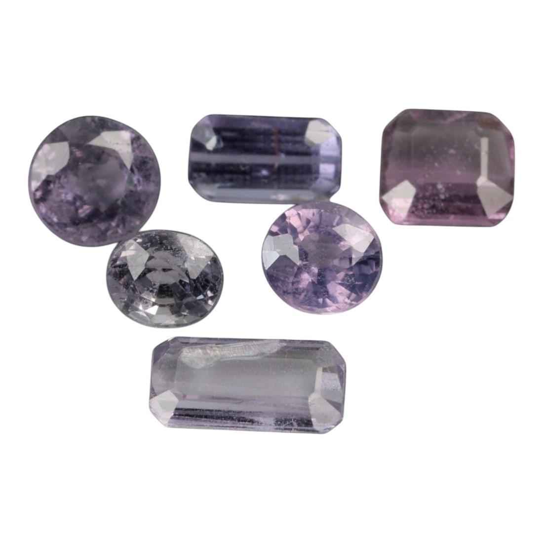 3.38 Carats Pastel Lavender Spinel Parcel - Natural Sri Lankan Stones, 47XP: This curated parcel of six loose spinel gems showcases a soft pastel palette ranging from pale lavender and lilac to delicate blush pink, with one stone exhibiting a nearly colorless, icy clarity. The