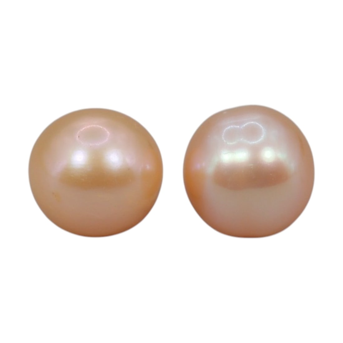 Freshwater Pearl Pair - Natural Peach Round Gemstones 7.3mm, 26XA: A matched pair of natural freshwater pearls, exhibiting a soft peach-gold hue with bright, uniform luster and subtle orient. The pearls are near-spherical, with smooth nacre and minor natural surface 