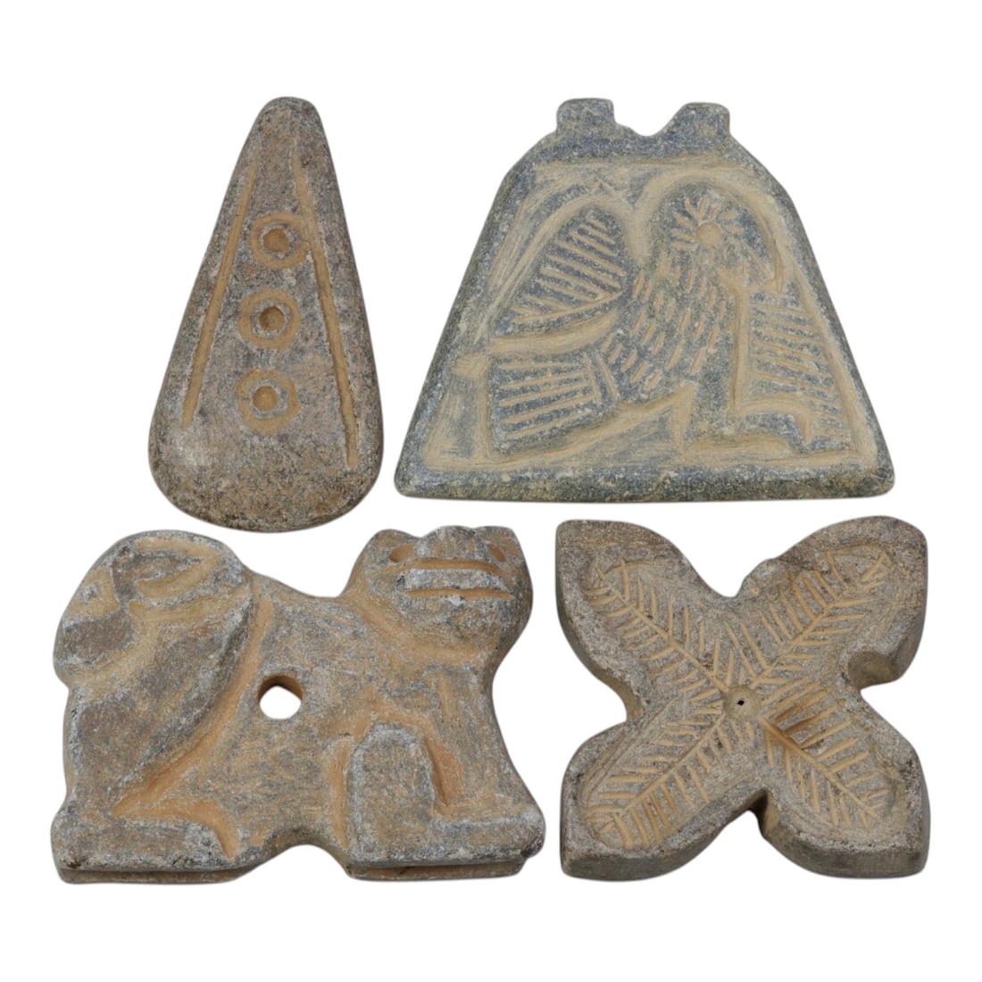 Lot of 4 Ancient Near Eastern Style Stone Amulets / Seals, 6WT: A curated lot of four ancient Near Eastern-style stone artifacts, each with unique forms and iconography, all showing natural patination and wear consistent with age:A triangular stone amulet with inc