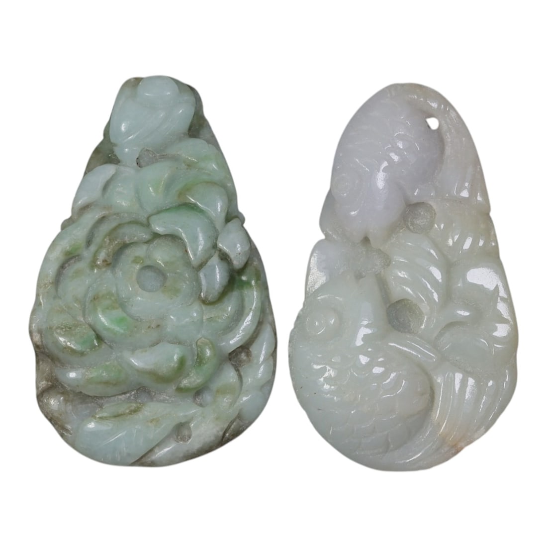 Lot of 2 Vintage Oriental Chinese Jadeite Jade Pendants, 27AG: The lot comprises two teardrop-shaped jadeite pendants. The left pendant is carved from mottled pale green jadeite with natural inclusions, featuring a high-relief flower motif with layered petals, a 
