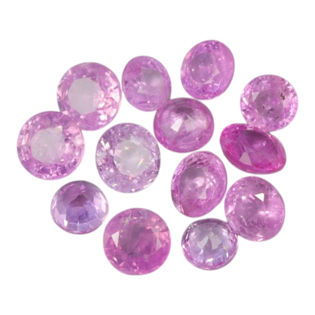 3.35 Carats Soft Pink Sapphire Parcel - Natural Ceylon Stones, 87XC: This delicate parcel of round and oval-cut pink sapphires showcases a range of soft pastel pink hues, from blush rose to warm lavender-pink tones. Each stone is faceted to maximize light play, creatin