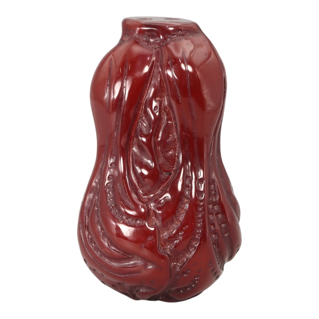 A Chinese Amber-Resin Cabbage Pendant, 20th Century, 38FC: Molded from translucent amber-colored resin with a deep red tone and high-gloss surface, the pendant is carved in the form of a cabbage with layered, curling leaves gathered into a compact, vertical c