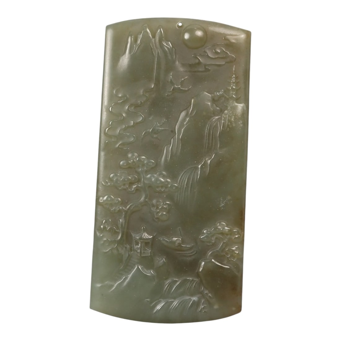 A Chinese Nephrite Jade Landscape Plaque, 20th Century, 81FC: Carved from pale celadon to grey-green nephrite jade with subtle tonal variation and minor natural inclusions, the object is worked as a vertically oriented plaque with a gently curved upper edge. The