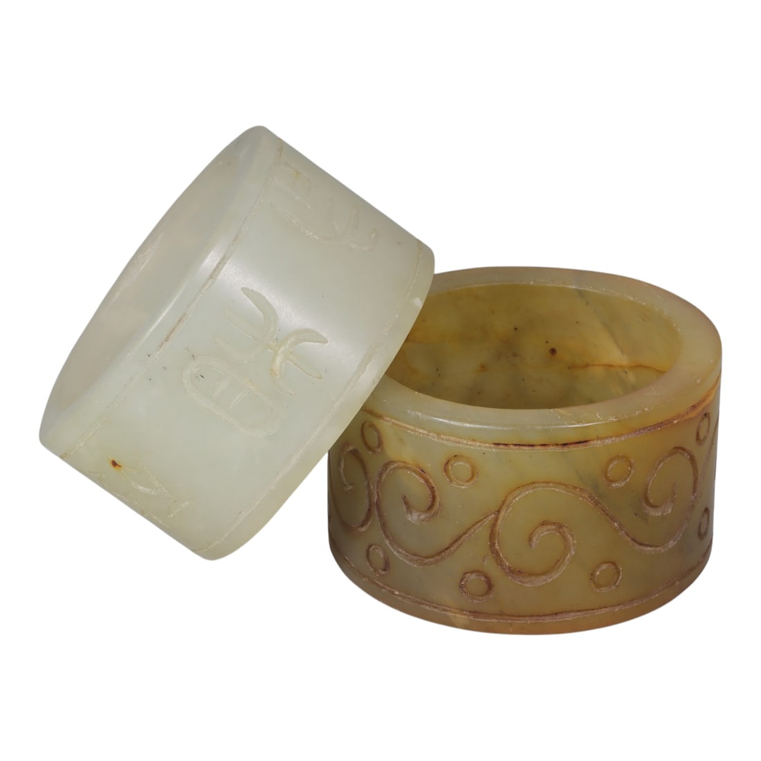 Lot of 2 Vintage Oriental Chinese Nephrite Jade Ring Pendants, 56AG: Carved from nephrite jade with natural color variations, the two cylindrical pendants feature incised decoration. The left example is pale, translucent jade with stylized archaic script characters etc