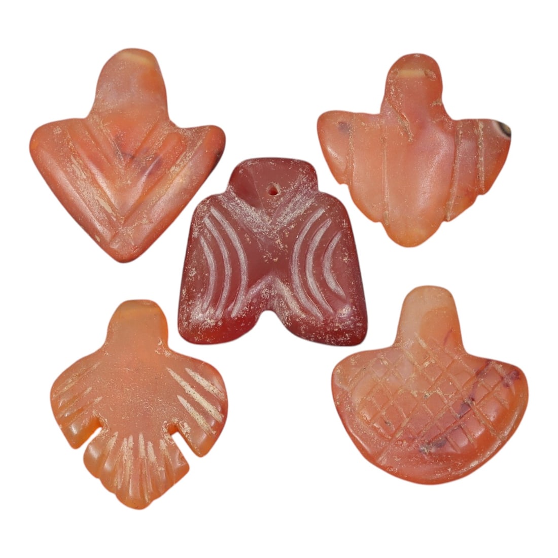 Lot of 5 Ancient Coptic Egyptian Carnelian Bird Amulets, Circa Roman Period to Coptic Era, 83AD: Comprising five stylized bird-shaped carnelian amulets ranging from 2 cm (3/4 in.) to 2.5 cm (1 in.), these pieces are characteristic of protective talismans from the Coptic Egyptian period. Each is c