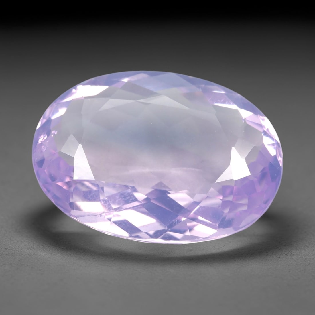 21.02 Carats Lavender Amethyst Oval - Natural Loose Gemstone, LZ62: This breathtaking 21.02 carat lavender amethyst is precision-cut into a classic oval shape, measuring 22.9mm x 16.8mm x 8.5mm. It glows with a soft, ethereal lavender hue, reminiscent of a misty twili