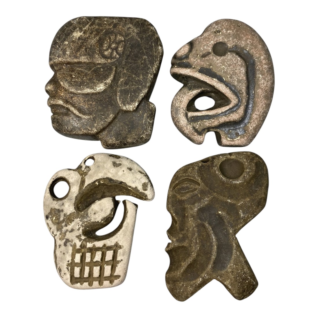 Lot of 4 Medieval Tribal Stone Carvings, 73AG: A collection of four hand-carved stone objects attributed to medieval tribal cultures, likely from the Mediterranean or Near Eastern regions. Crafted from weathered stone in varied tones-dark brown, p