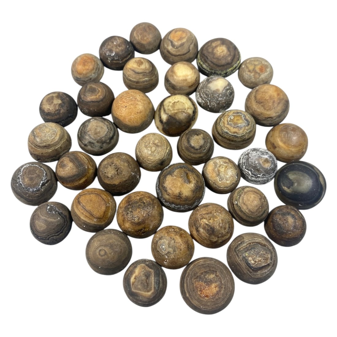 Lot of 38 Antique Tibetan Luk Mik Goat Eye Agate Beads, 43AC: A collection of thirty-eight spherical agate beads, known as luk mik or goat eye beads, each exhibiting natural concentric banding patterns in earthy tones of brown, grey, tan, and occasional contrast
