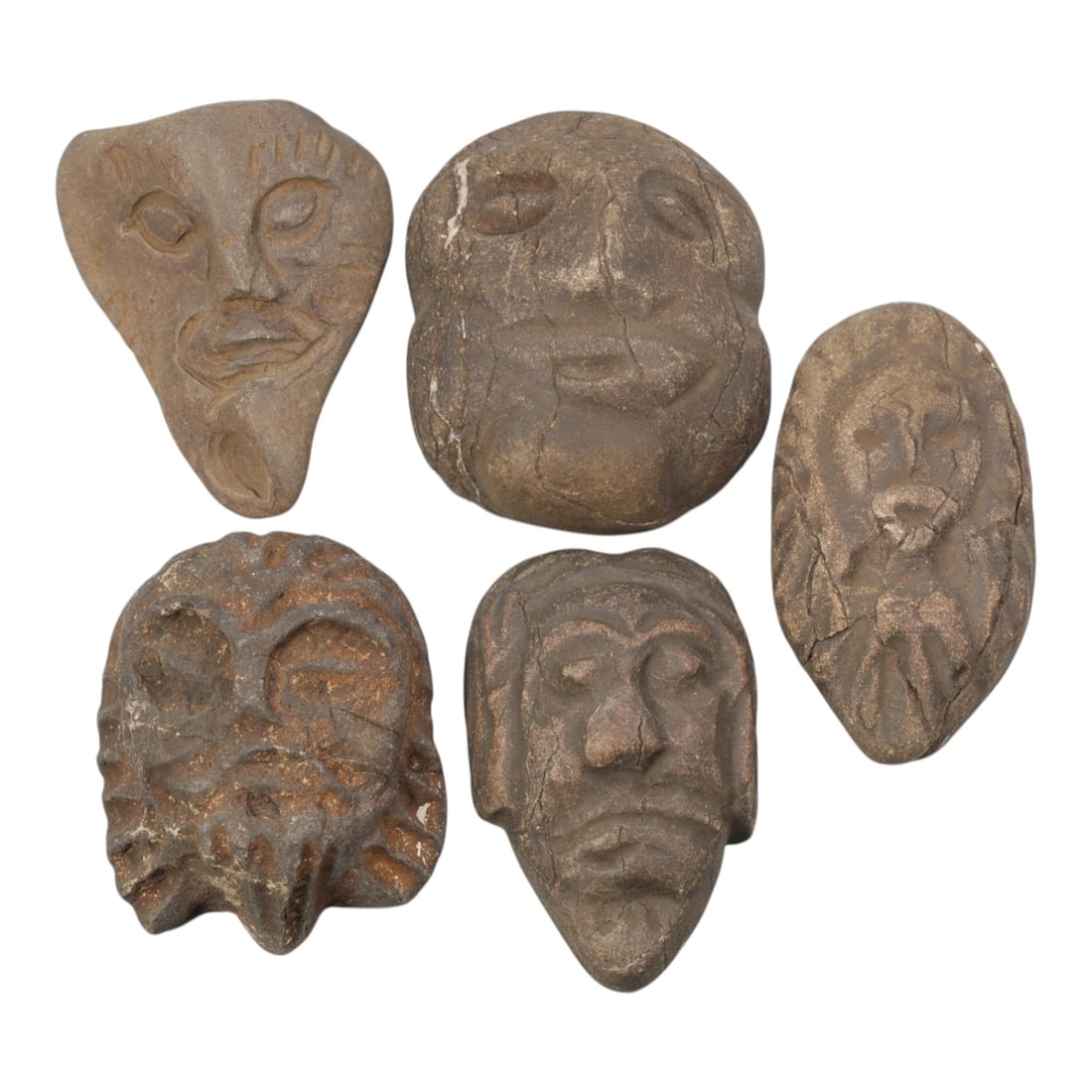 Lot of 5 Medieval Mediterranean Stone Head Carvings, 25WT: A collection of five small stone head carvings, each depicting stylized human faces worked from weathered brown stone with visible patina, surface cracks, and age-related wear. The group features vari