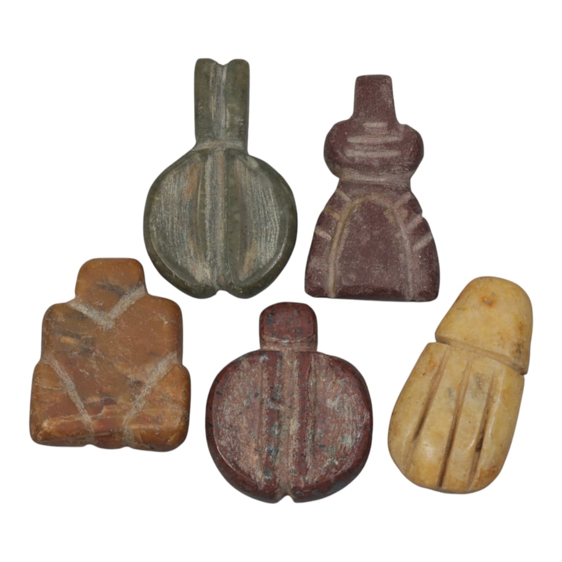 Lot of 5 Ancient Coptic Egyptian Stone Amulets, Circa Roman to Coptic Era, 47WL: Crafted from a variety of red, yellow, and greenish stone, this set of five amulets features diverse forms: a rounded pendant, a stylized figure, a scarab, a fan-shaped amulet, and a geometric pendant