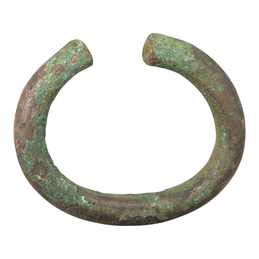 Ancient Roman Bronze Bracelet - Open Cuff Form, 37BN: Crafted from bronze, this open bracelet features a robust, rounded horseshoe form with a narrow gap between flat, undecorated terminals. The surface displays a thick, uneven patina of verdigris green 