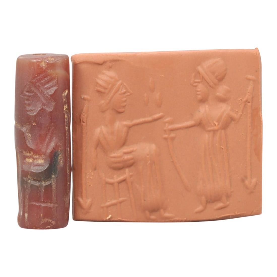 Ancient Carnelian Cylinder Seal - Mesopotamian Figural Ritual Scene, 73ZS: Carved from richly hued carnelian, this ancient Mesopotamian cylinder seal features a refined linear relief composition of two human figures in ritual interaction-one seated on a stool and gesturing, 