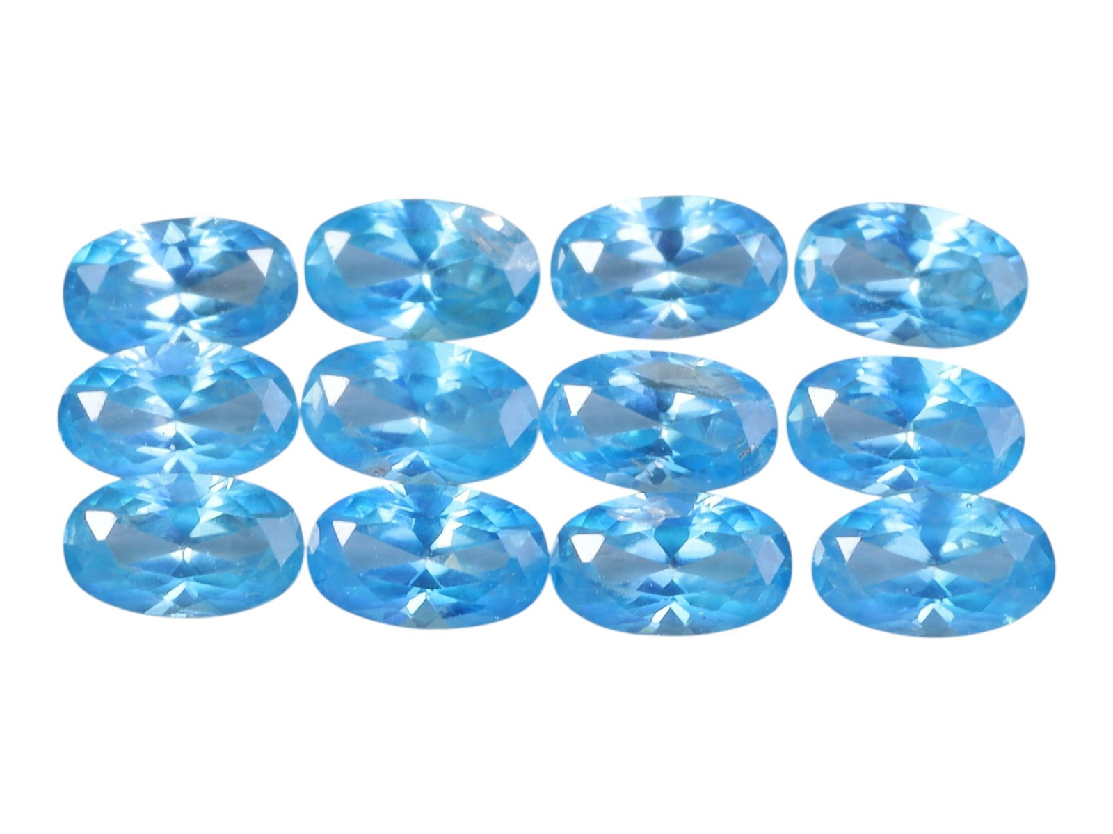 3.68 Carats Sky Blue Zircon Oval Parcel - Natural Loose Stones, 98XH: This luminous parcel of blue zircon gems dazzles with a bright, crisp sky-blue hue, reminiscent of clear tropical waters and summer skies. The total carat weight of the lot is 3.68 carats, with each o