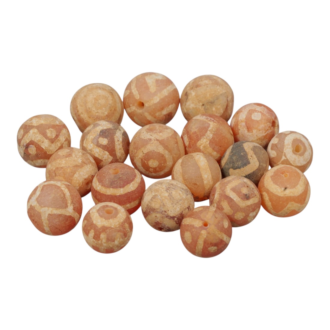Lot of 19 Ancient Etched Carnelian Beads, Gandhara Period, 24WM: A group of 19 ancient etched carnelian beads from the Gandhara period. The beads are primarily spherical, crafted from warm reddish-orange carnelian with occasional greyish and lighter-toned examples.
