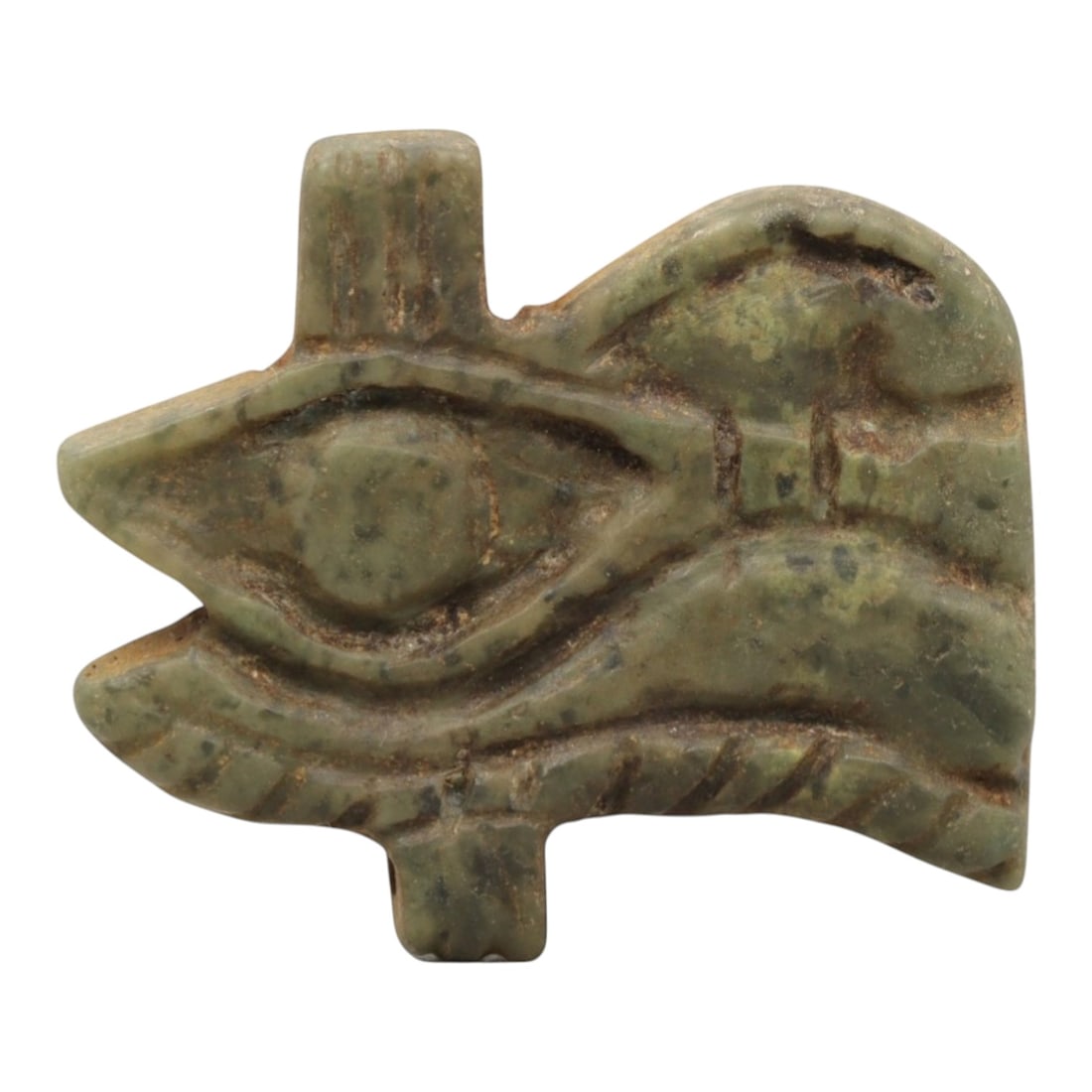 Ancient Serpentine Wedjet Eye Amulet - Egyptian Figurine, 88ZP: This artifact is a carved serpentine Wedjet Eye amulet, executed in the iconic protective tradition of ancient Egypt. The amulet depicts the Wedjet (or Eye of Horus) with distinct incised details: a c