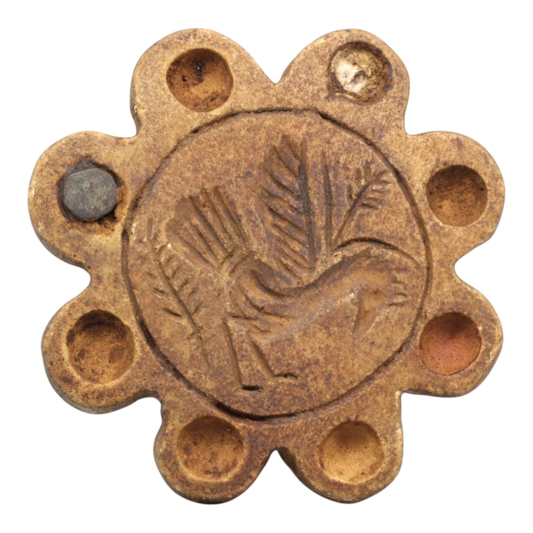Ancient Steatite Stamp Seal - Near Eastern Bird Motif, 81ZP: This lobed stamp seal is carved from steatite, featuring a central medallion incised with a striding bird motif, detailed with feathered wings and a stylized beak, surrounded by eight evenly spaced ci