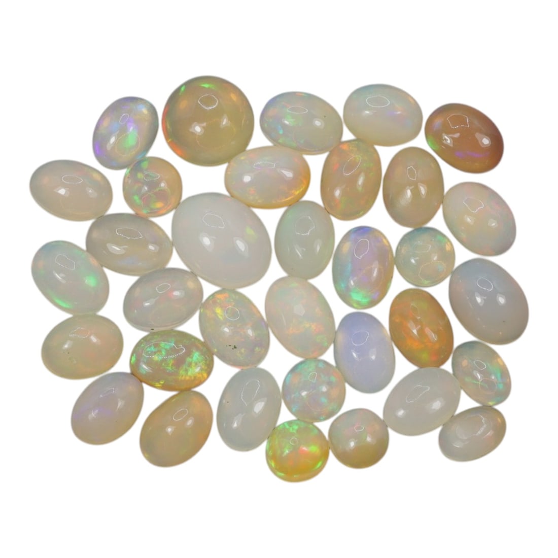17.70 Carats Welo Opal Cabochon Parcel - Natural Ethiopian Stones, 49XA: This vibrant collection of Welo opals features a stunning variety of translucent body tones, from milky white and soft cream to warm honey and golden-orange, each adorned with vivid, shifting color pl