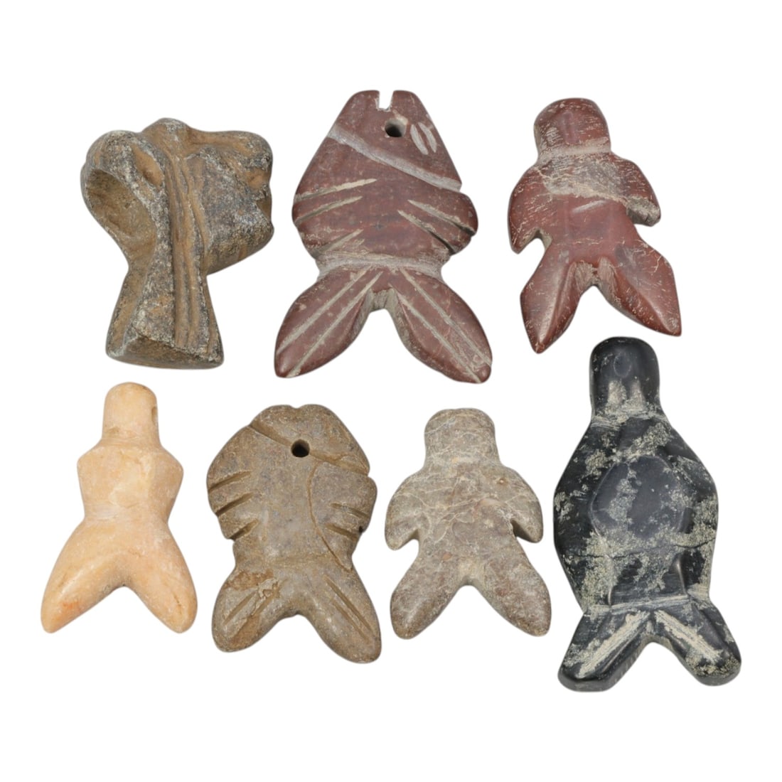 Lot of 7 Ancient Coptic Egyptian Multi-Stone Amulets, Circa Roman to Coptic Era, 78AH: Carved from various earth-toned stones including grey, reddish-brown, light beige, and black varieties, the group consists of seven distinct amulets, ranging in size from 2.5 cm to 4 cm (0.98-1.57 in.