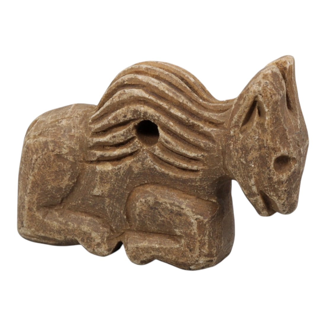 Ancient Near Eastern Style Stone Recumbent Zoomorphic Equine Amulet, 87WM: A single ancient Near Eastern-style stone amulet, carved in the form of a recumbent equine (horse). The piece features stylized, incised wavy lines representing the mane, simplified facial features, a