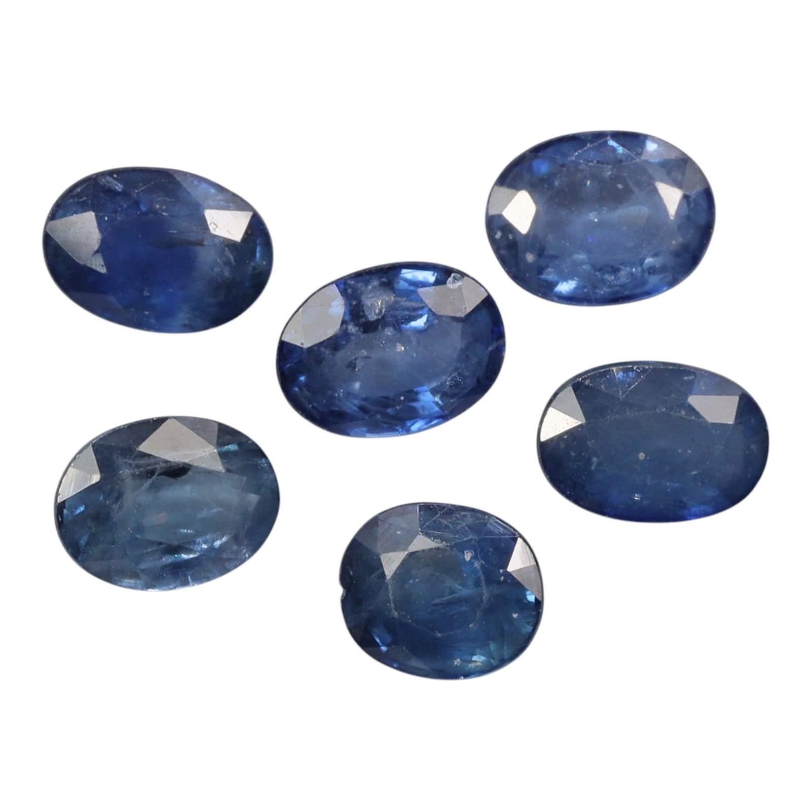 5.69 Carats Cornflower Blue Sapphire Oval Parcel - Natural Loose Stones, 4XB: This curated parcel of sapphires showcases a rich spectrum of natural blue hues, from soft sky blue to deeper cornflower tones, each stone glowing with the characteristic depth of fine sapphire. The t