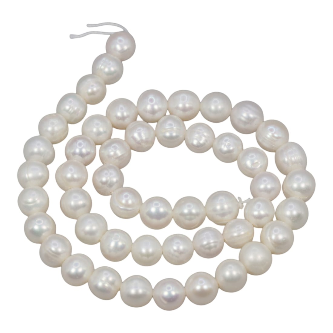 A Strand of Cultured Pearls, 20th Century, 84ZJ: Composed of uniformly sized, near-round cultured pearls with a creamy white body color and subtle iridescent overtones, the strand is strung in a single continuous line. Each pearl exhibits a smooth, 