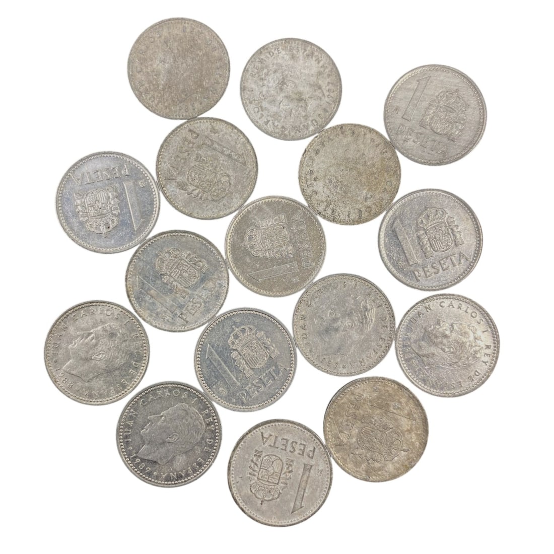 SPAIN: Post-Franco Transition - 1 Peseta Bulk Coin Lot, 26V: This bulk lot of Spanish 1 Peseta coins captures the visual language of Spain's democratic transition, featuring the portrait of King Juan Carlos I and the national coat of arms. Minted in aluminum-br