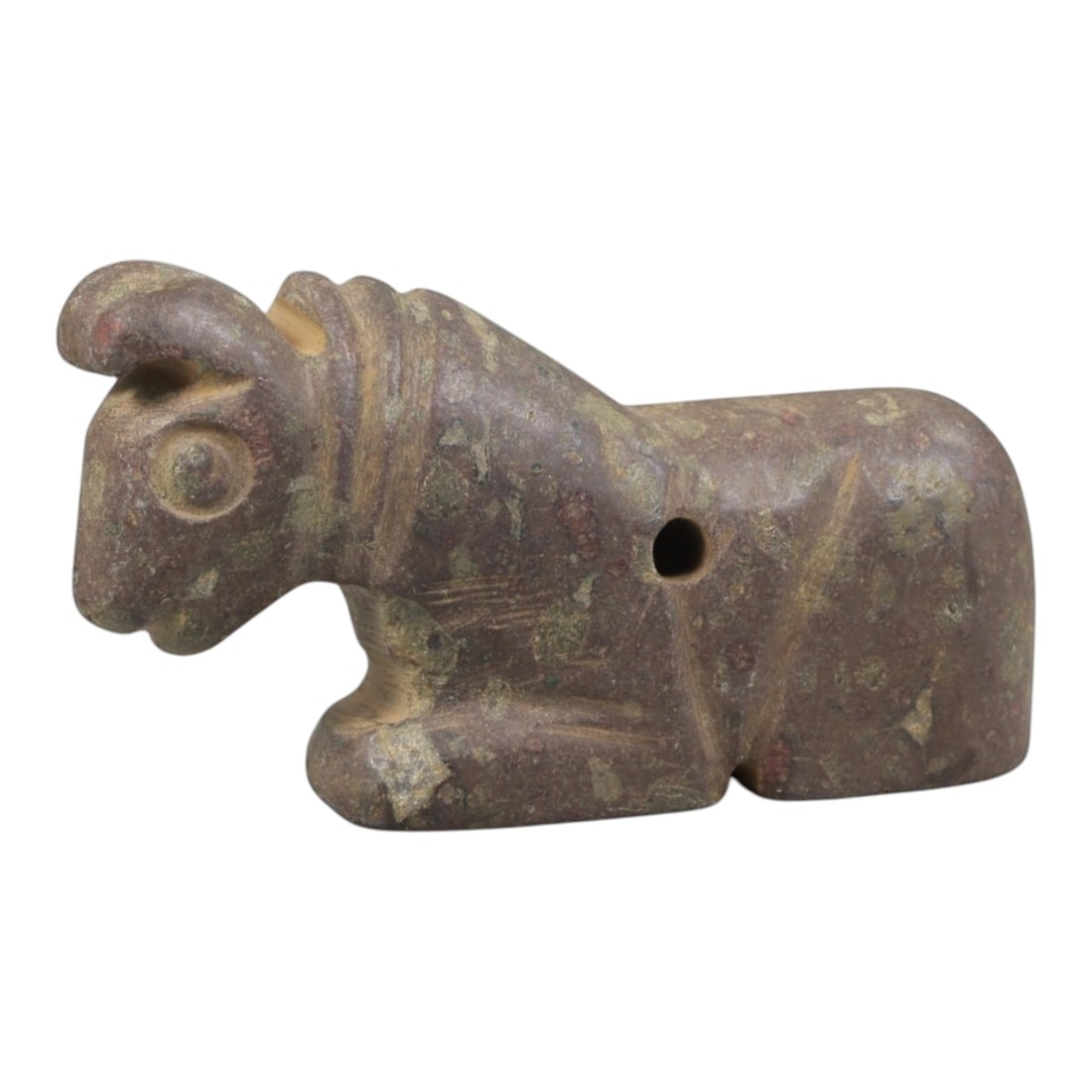 Ancient Stone Recumbent Bull Amulet - Near Eastern Carved Figurine, 75FY: Carved from polished, multi-hued hardstone (likely serpentine or steatite), this amulet takes the form of a stylized recumbent bull (a symbol of strength and protection in ancient Near Eastern culture
